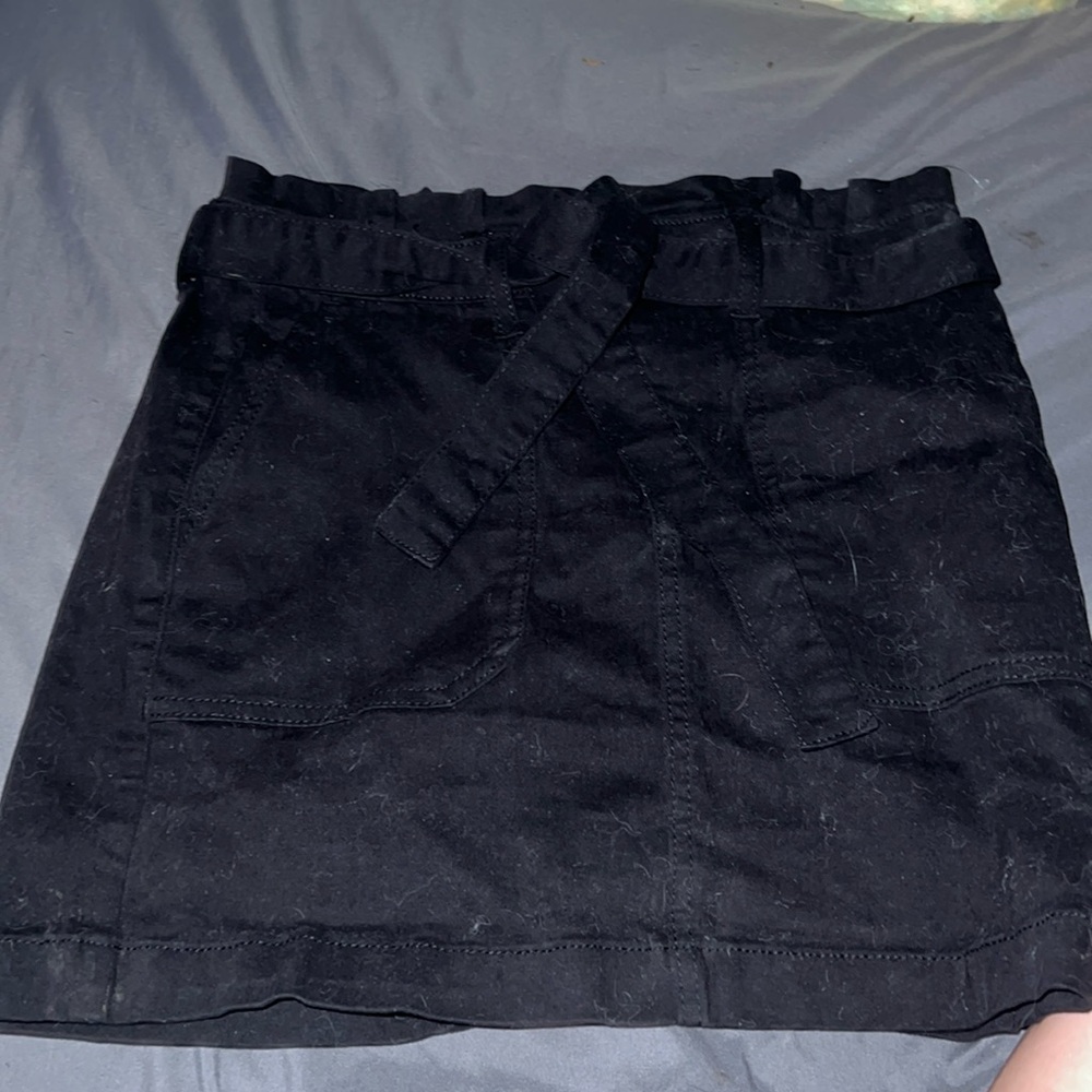 Black skirt, ties in the front.